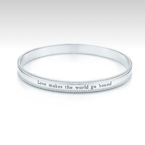 Tiffany & Co. “Love Makes The World Go ‘Round” Bangle Bracelet